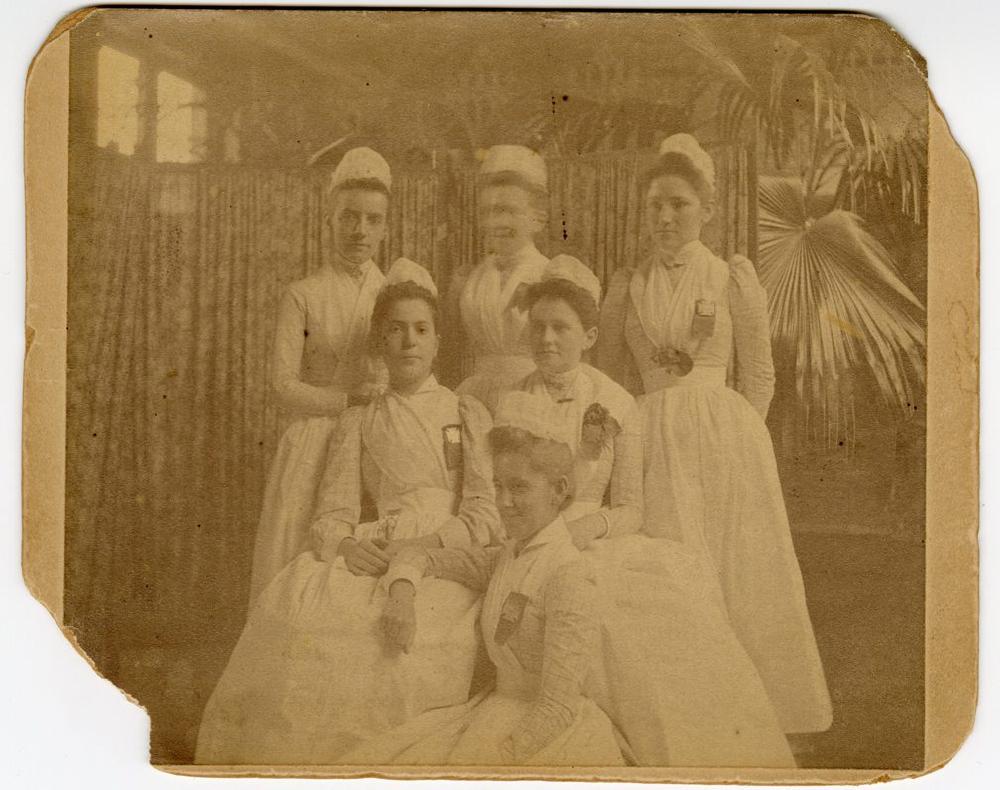 Lillian Wald’s 1891 nursing school graduation photo. She is seated at left.