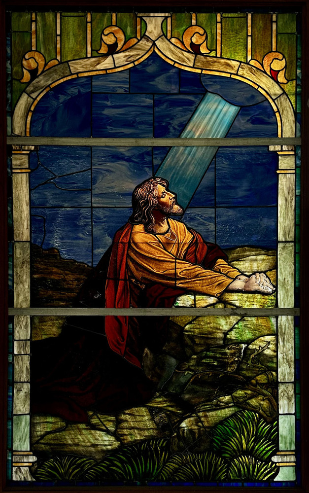 An original stained-glass window from Carmel Presbyterian Church at Ninth and Linn Streets, now in the church’s current facility